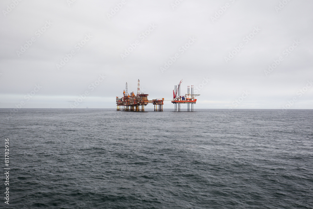 Fototapeta premium Oil platform on the North Sea while cloudy day