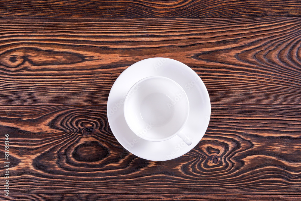 Blank white cup on the old boards.