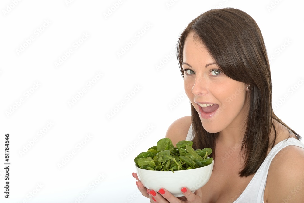 Happy Attractive Young Woman Holding a Plate of Fresh Spinach Happy Attractive Young Woman Holding a Plate of Fresh Spinach