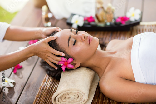 Asian woman in the spa salon, massage the head