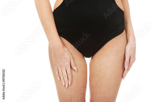 Woman's body in swimsuit.