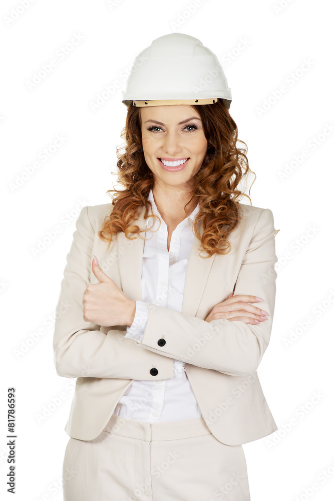 Businesswoman with thumbs up wearing helmet. Businesswoman with thumbs up wearing helmet.