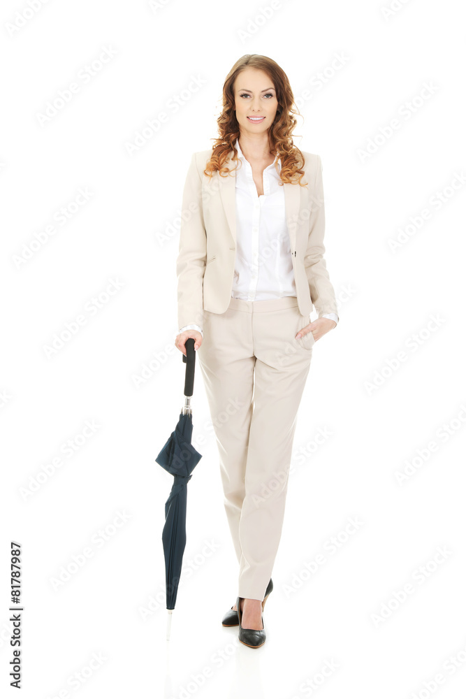 Businesswoman holding an umbrella. Businesswoman holding an umbrella.
