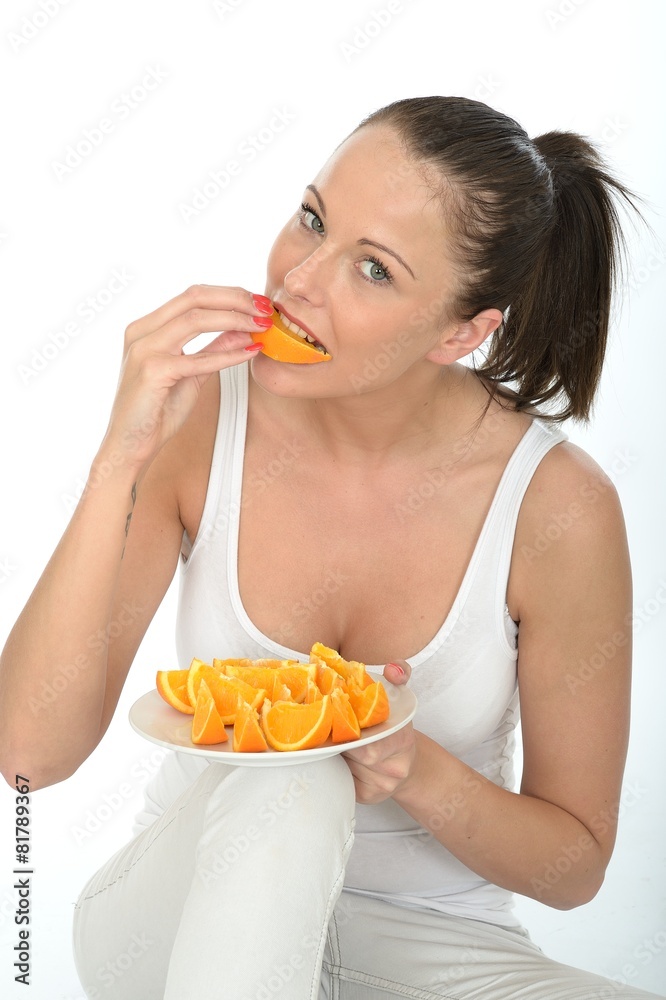 Attractive Young Woman Holding a Plate of Cut Oranges Attractive Young Woman Holding a Plate of Cut Oranges
