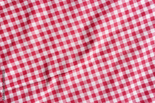 Red and white picnic tablecloth texture.