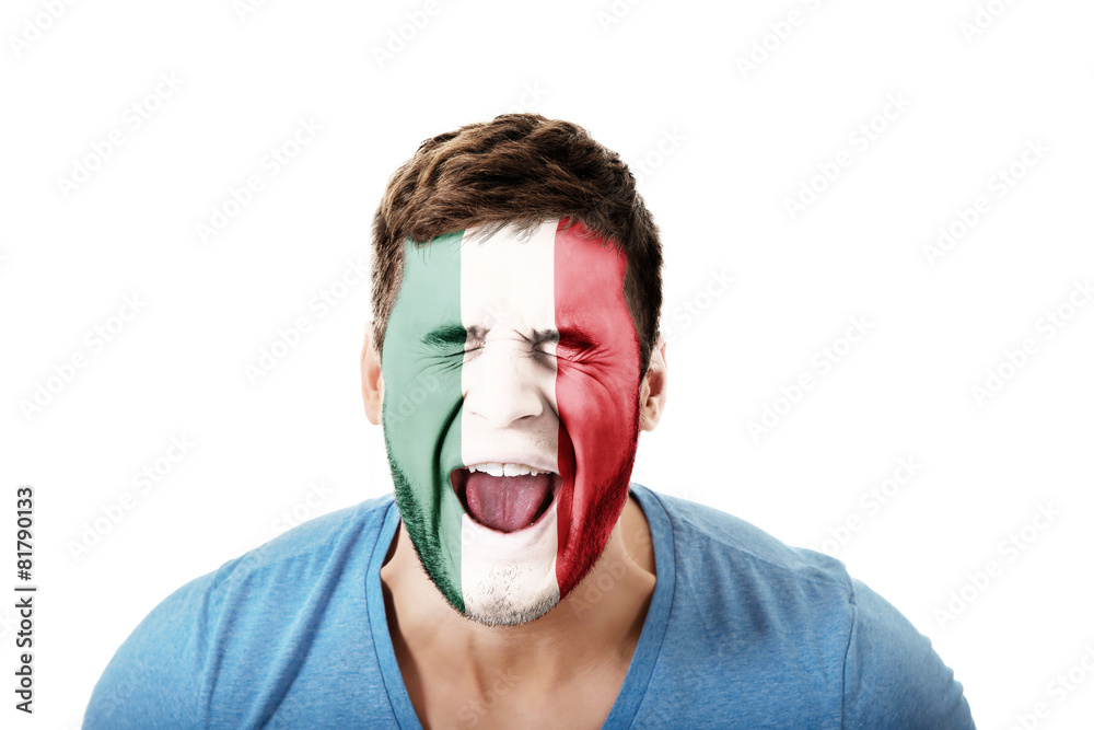 Screaming man with Mexico flag on face.