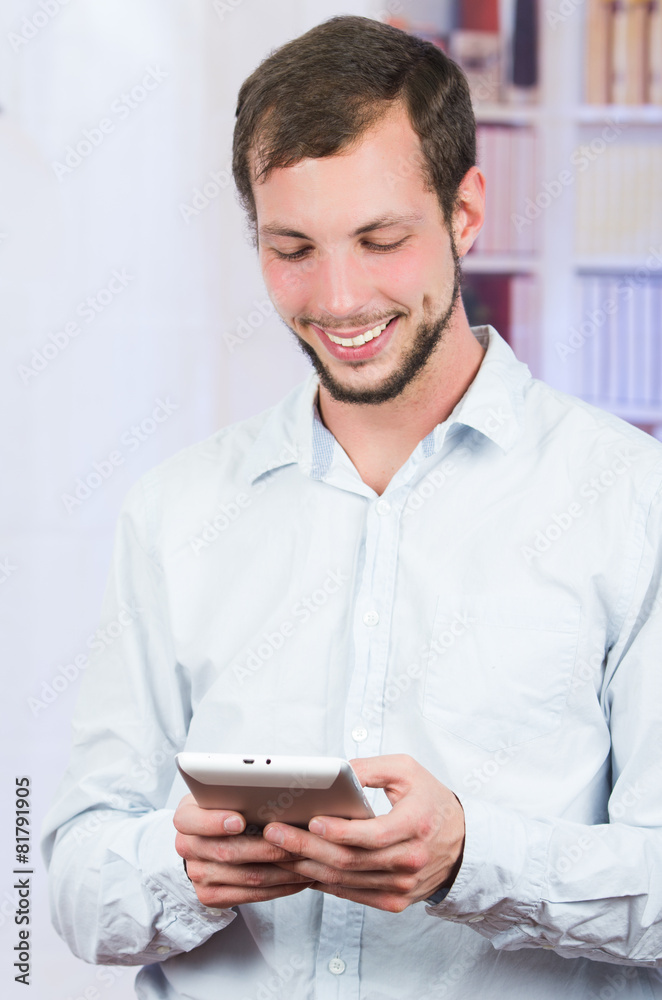 smiling handsome man using tablet smiling handsome man using tablet
