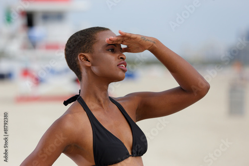 Woman on the lookout on the beach