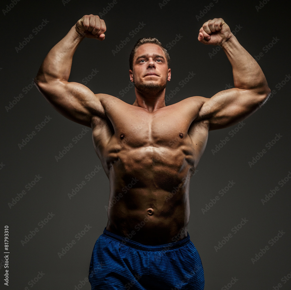 Fototapeta premium Muscular man posing in studio