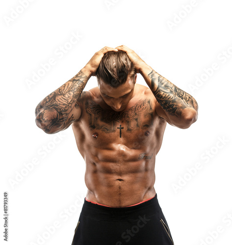 Muscular guy with tattooed body