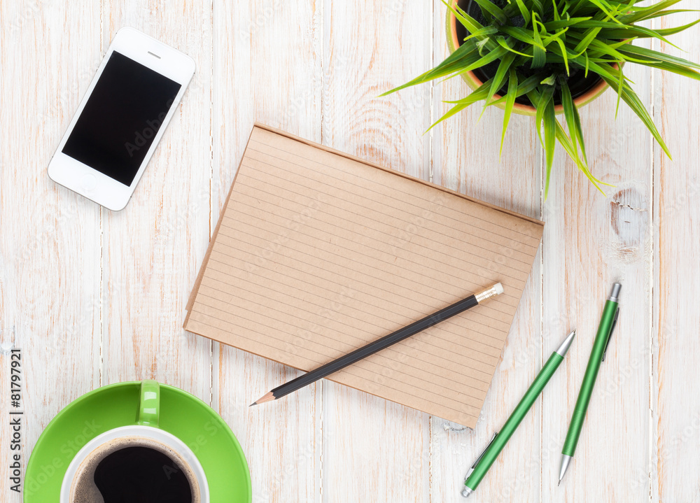 Office desk table with supplies, coffee cup and flower Office desk table with supplies, coffee cup and flower