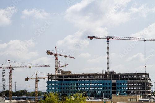 Construction site with cranes .