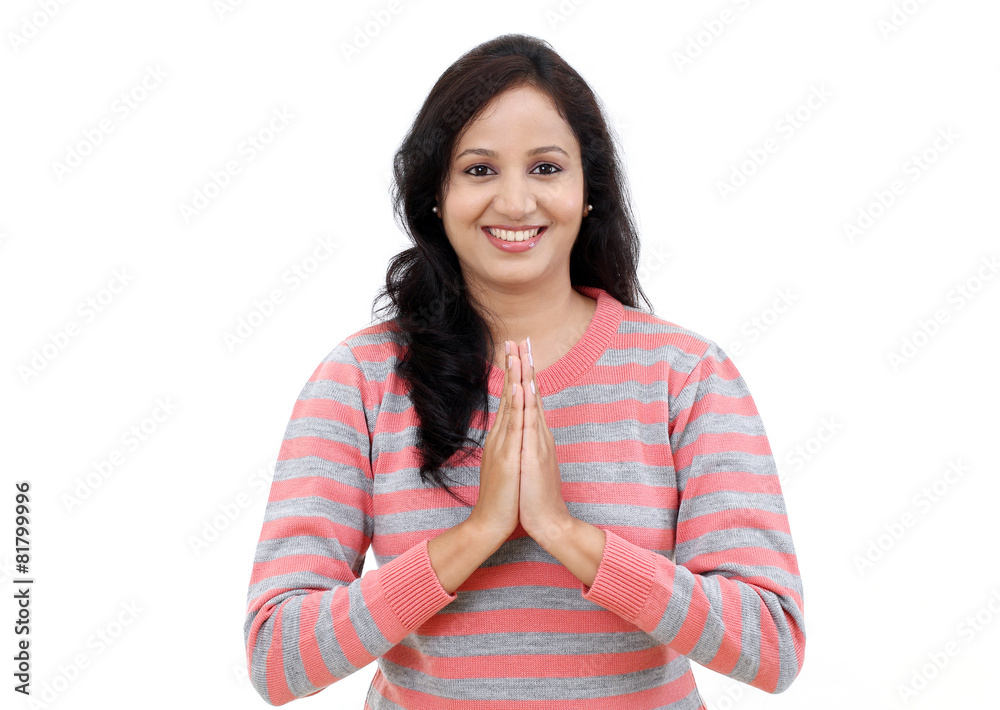Portrait of young Indian woman holding hands in prayer position Portrait of young Indian woman holding hands in prayer position