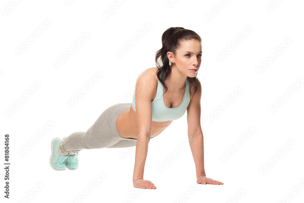 athletic woman doing push-ups . Fitness model athletic woman doing push-ups . Fitness model