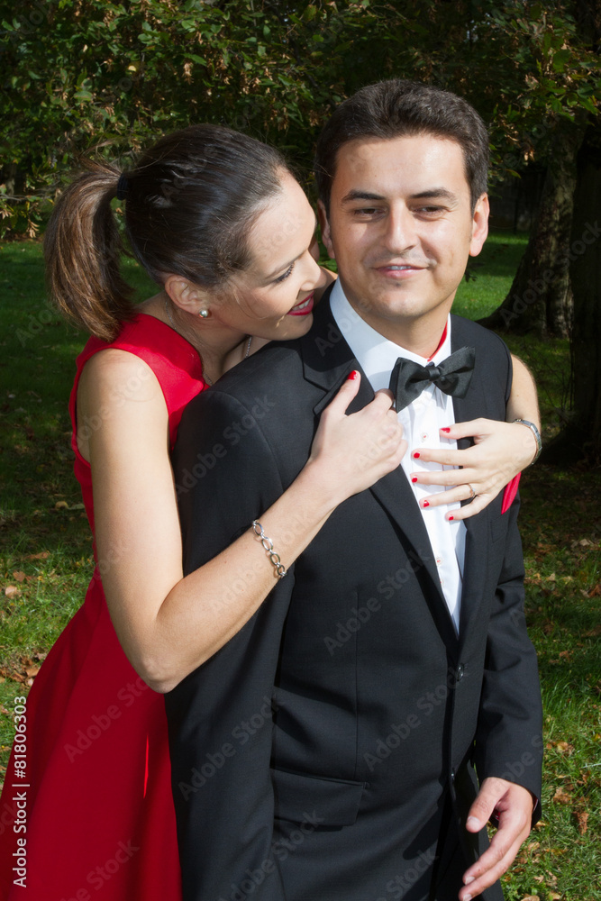 Loving couple in bright clothes dancing on the park Loving couple in bright clothes dancing on the park