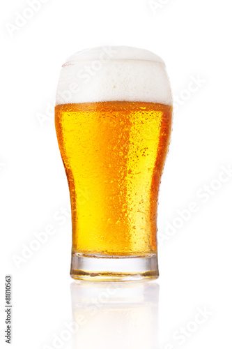 Glass of light beer isolated on a white background.