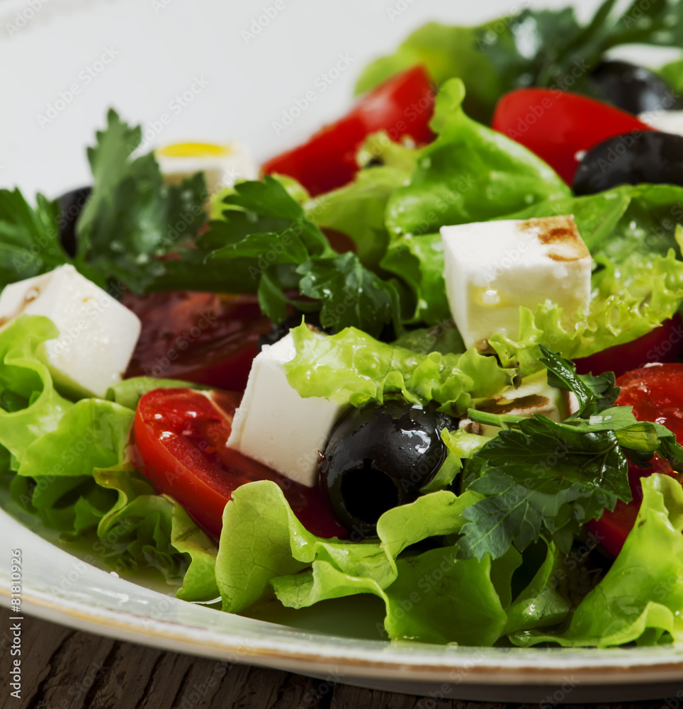 salad with tomatoes, olives and cheese, selective focus salad with tomatoes, olives and cheese, selective focus