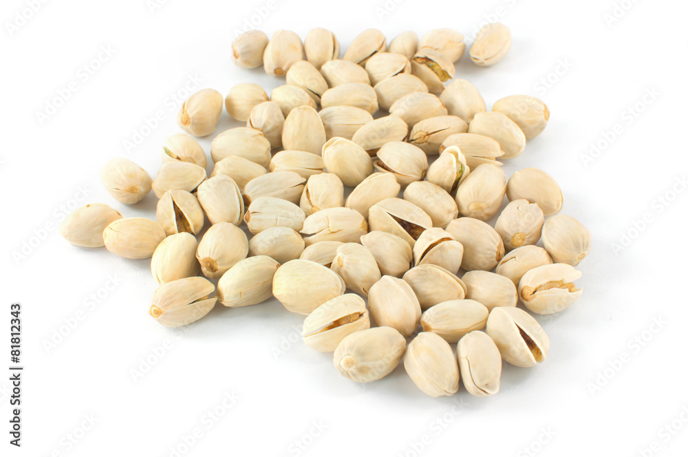 Close up of fresh pistachios on white