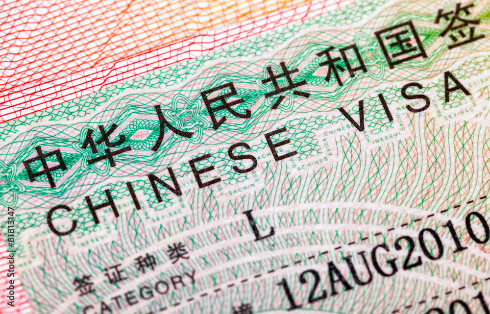 Obraz premium Fragment of Chinese visa in passport close up