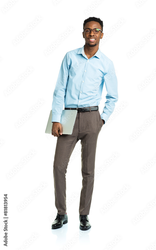 Fototapeta premium Happy african american college student with laptop standing on w