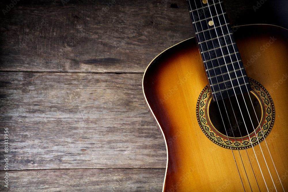 Guitar against a rustic wood Guitar against a rustic wood