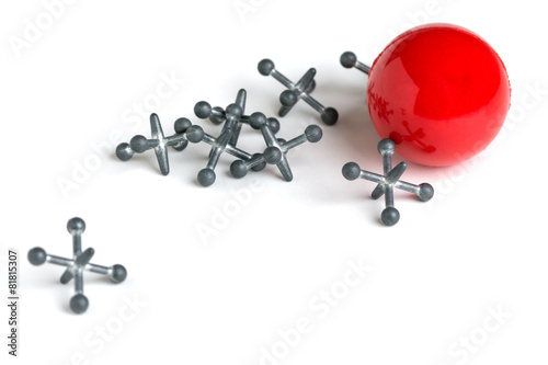 Jacks with Red Ball on White Background photo