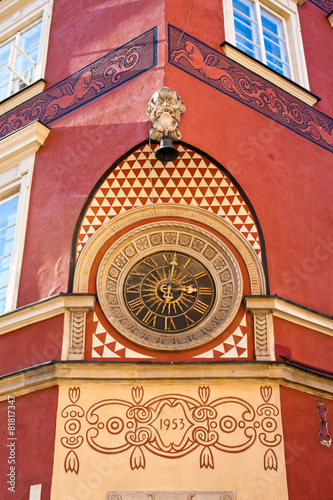 Old clock on the wall in the old town of Warsaw #81817347