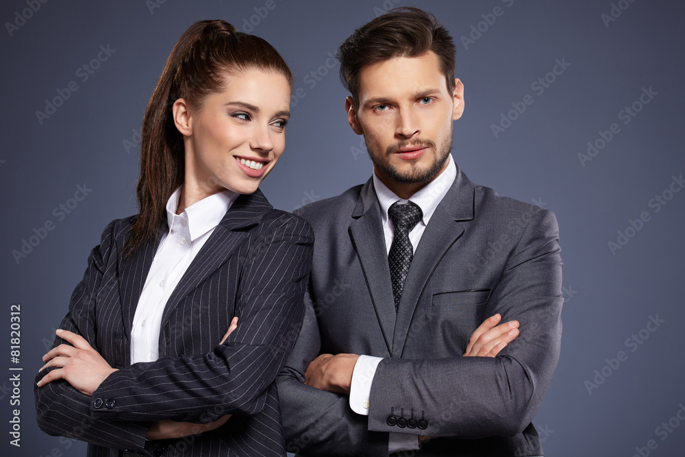 A couple of managers in suits on the blue background A couple of managers in suits on the blue background