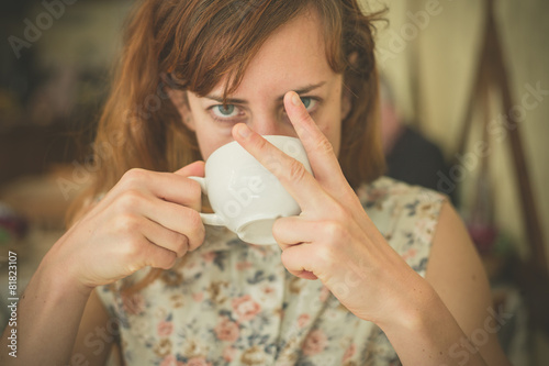 Woman drinking coffee and swearing