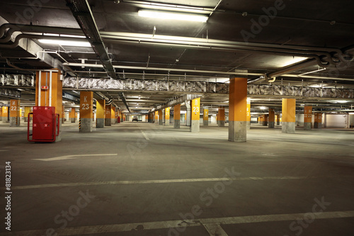 Image of parking garage underground interior, dark industrial