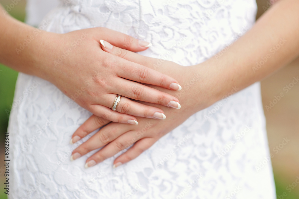 Hands of the bride with a ring and manicure close-up Hands of the bride with a ring and manicure close-up
