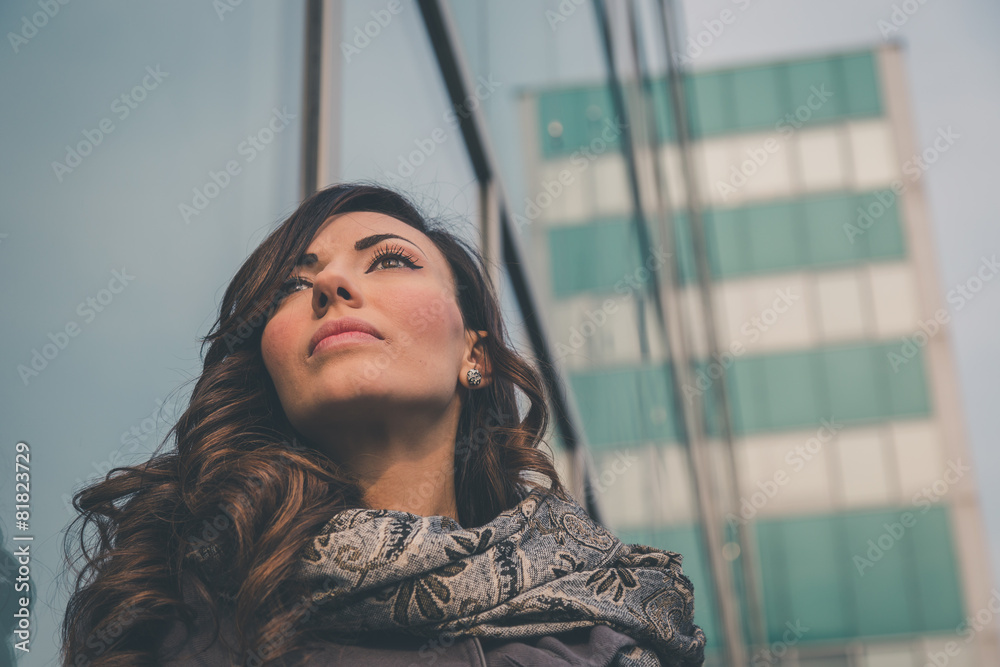 Fototapeta premium Beautiful girl posing in an urban context