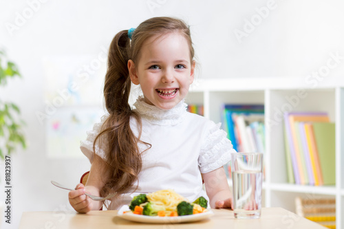 kid eating healthy food at ...