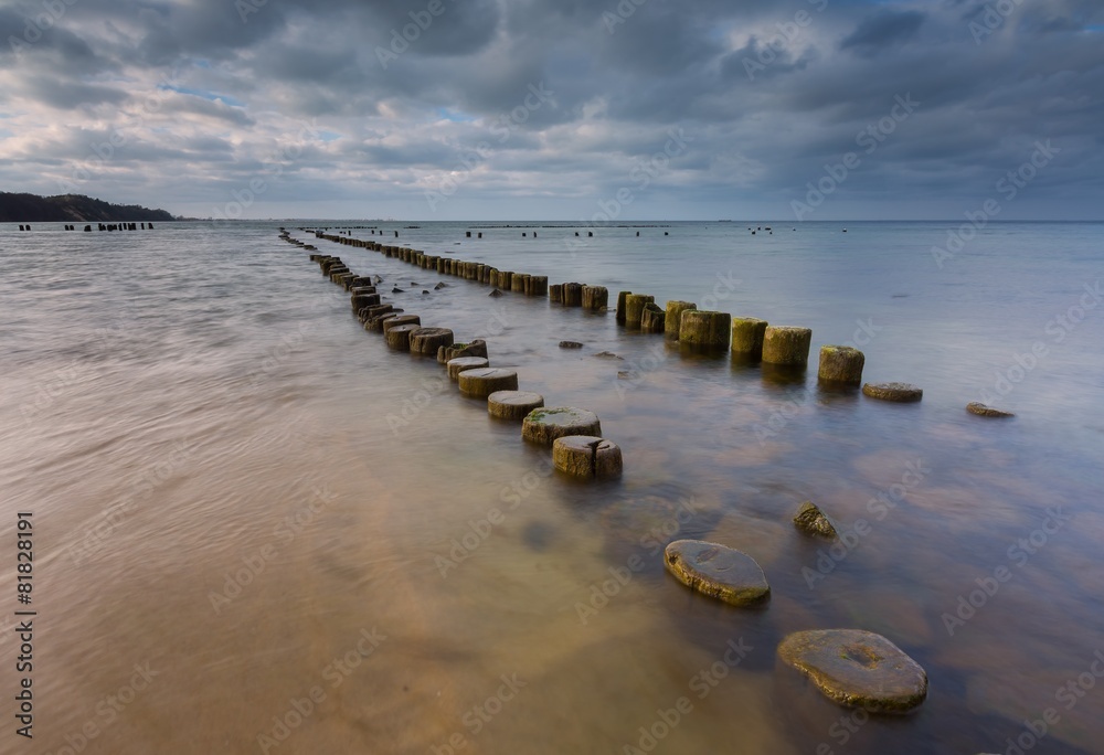 Sandy shore of Baltic sea and torpedownia near Gdynia.