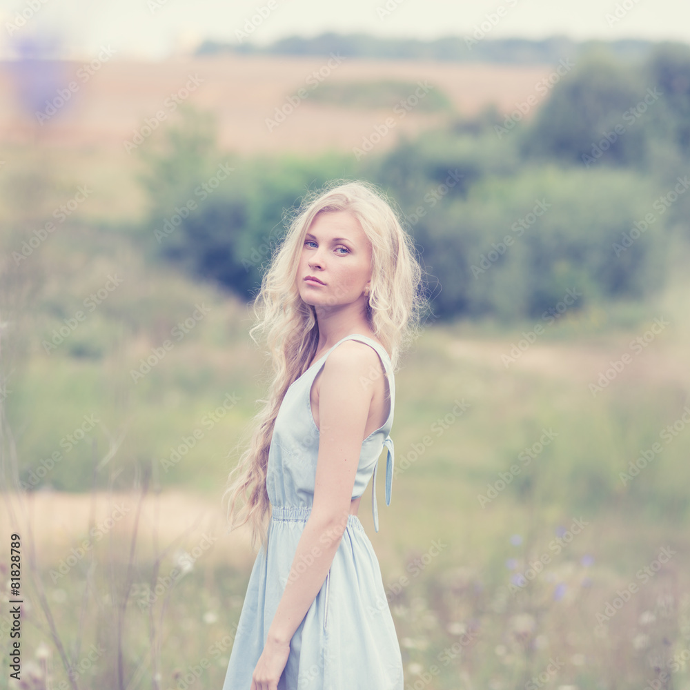 portrait of a beautiful blonde in a field in spring portrait of a beautiful blonde in a field in spring