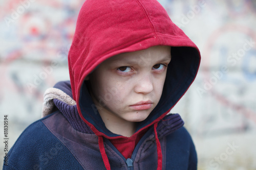 dramatic portrait of a homeless boy