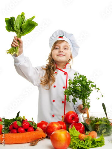 child in the kitchen preparing a meal