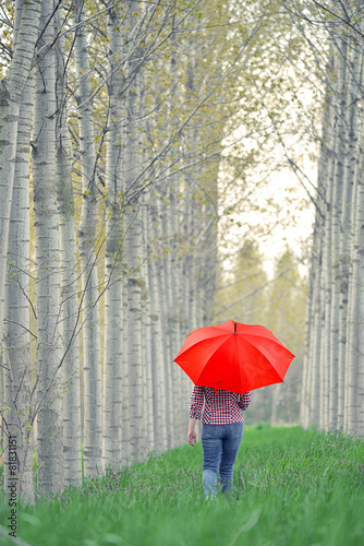 Woman with Red Umbrella Walking Away