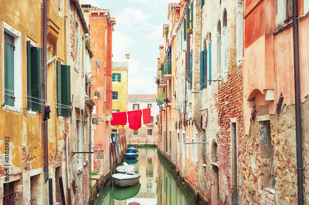 Narrow canal in Venice, Italy.