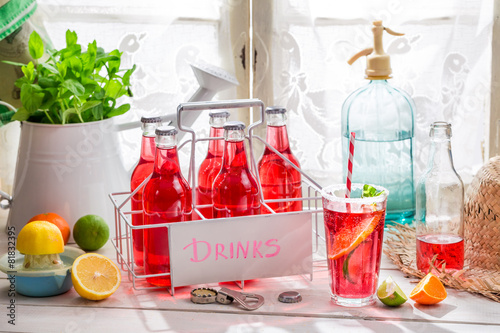 Tasty red orangeade in bottle