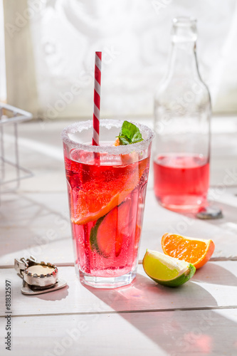 Cold orangeade in bottle with mint leaf