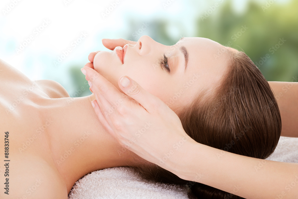 Woman recieving face massage.