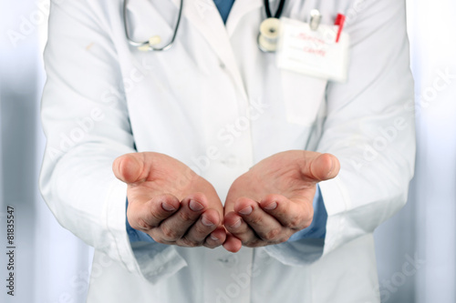 Hands of medical doctor with a stethoscope