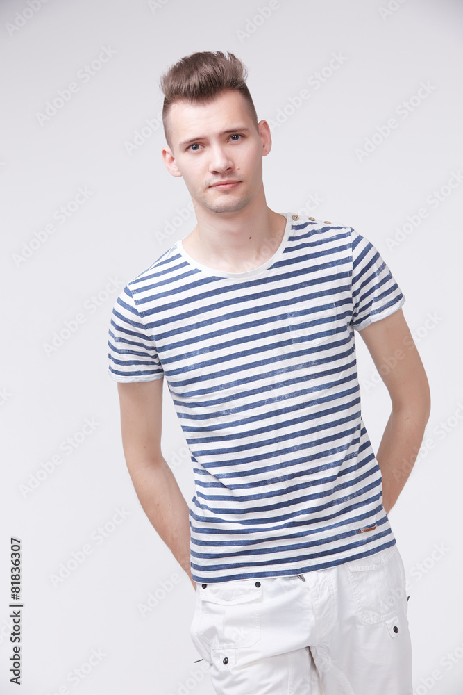 young guy in a striped sweater like a sailor young guy in a striped sweater like a sailor