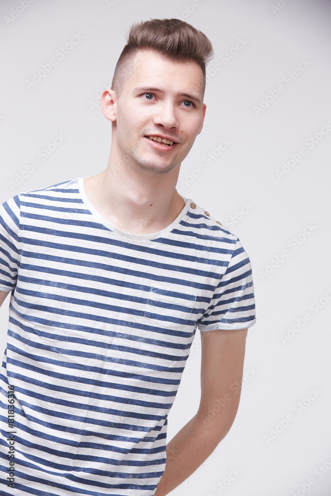 young guy in a striped sweater like a sailor young guy in a striped sweater like a sailor