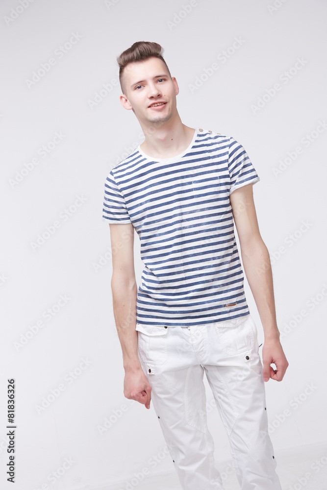 young guy in a striped sweater like a sailor young guy in a striped sweater like a sailor