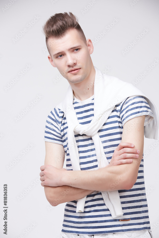 young guy in a striped sweater like a sailor young guy in a striped sweater like a sailor