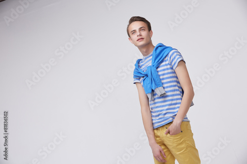 young guy in a striped sweater © photoniko