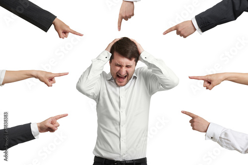 many fingers pointing at man