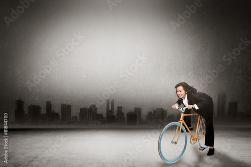 Fototapeta Naklejka Na Ścianę i Meble -  Business Woman Riding Bike Concept